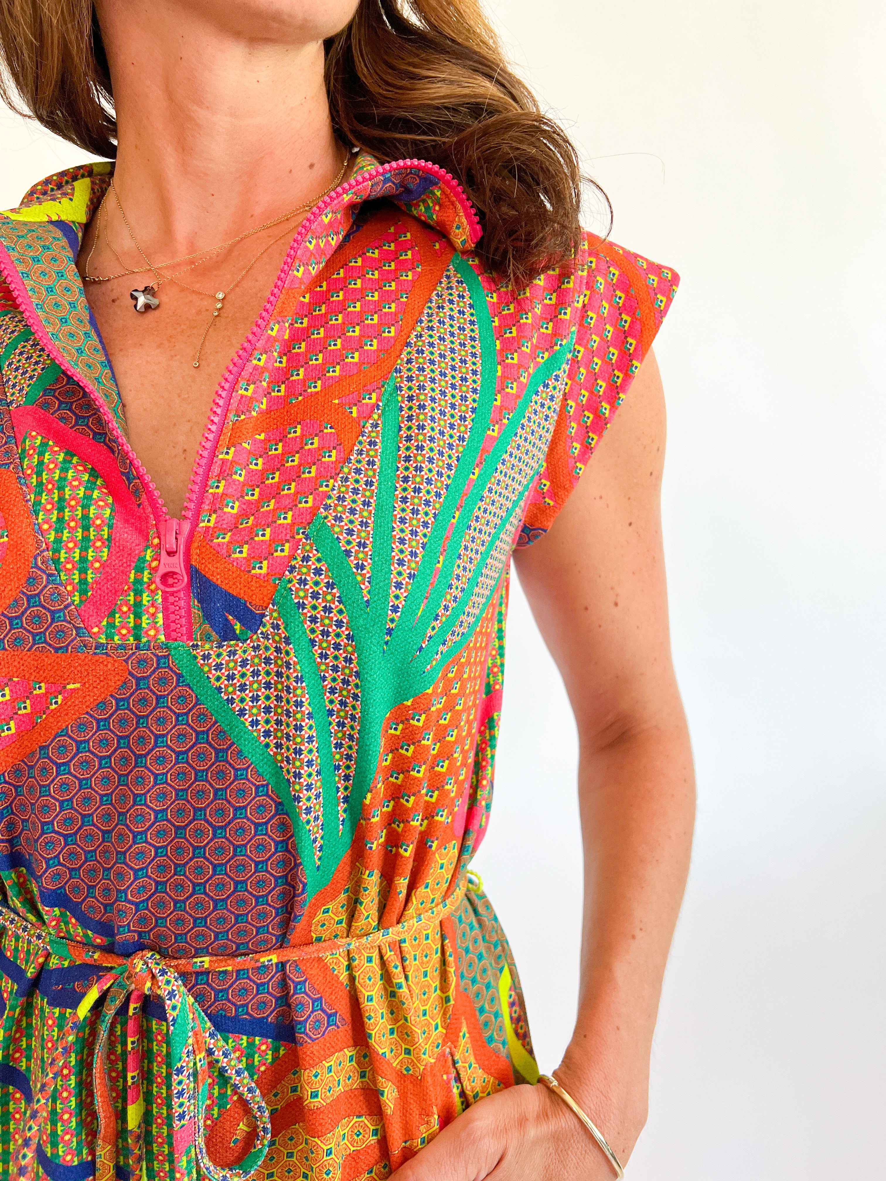 a woman wearing a colorful dress