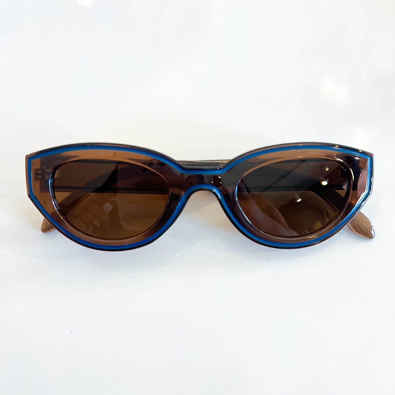 Brown cat-eye sunglasses with vintage-inspired silhouette