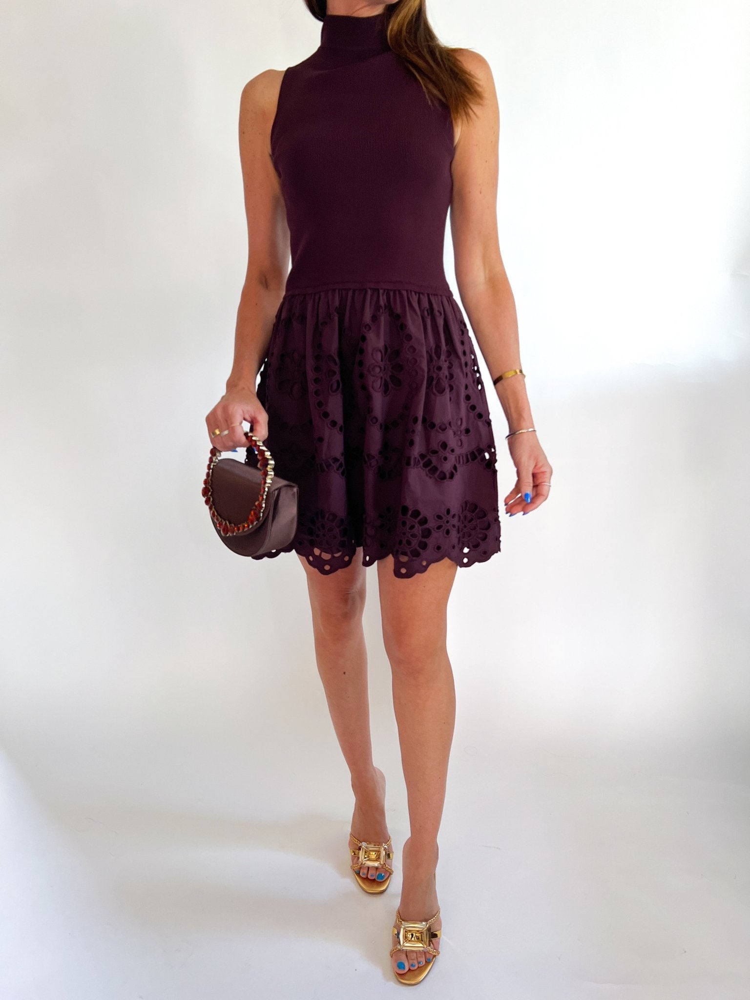 Chocolate brown mini dress with sleeveless silhouette
