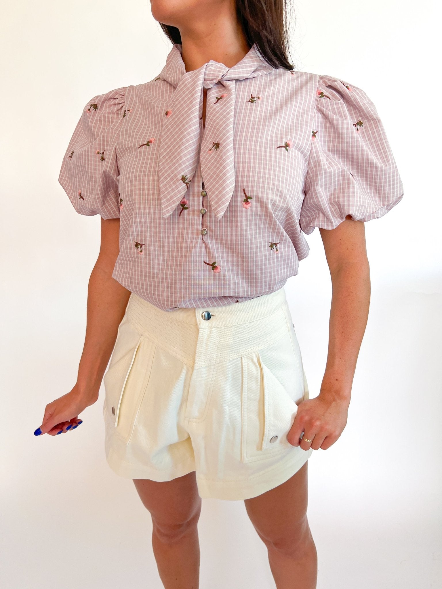 Pink embroidered top with tie-neck and puff sleeves