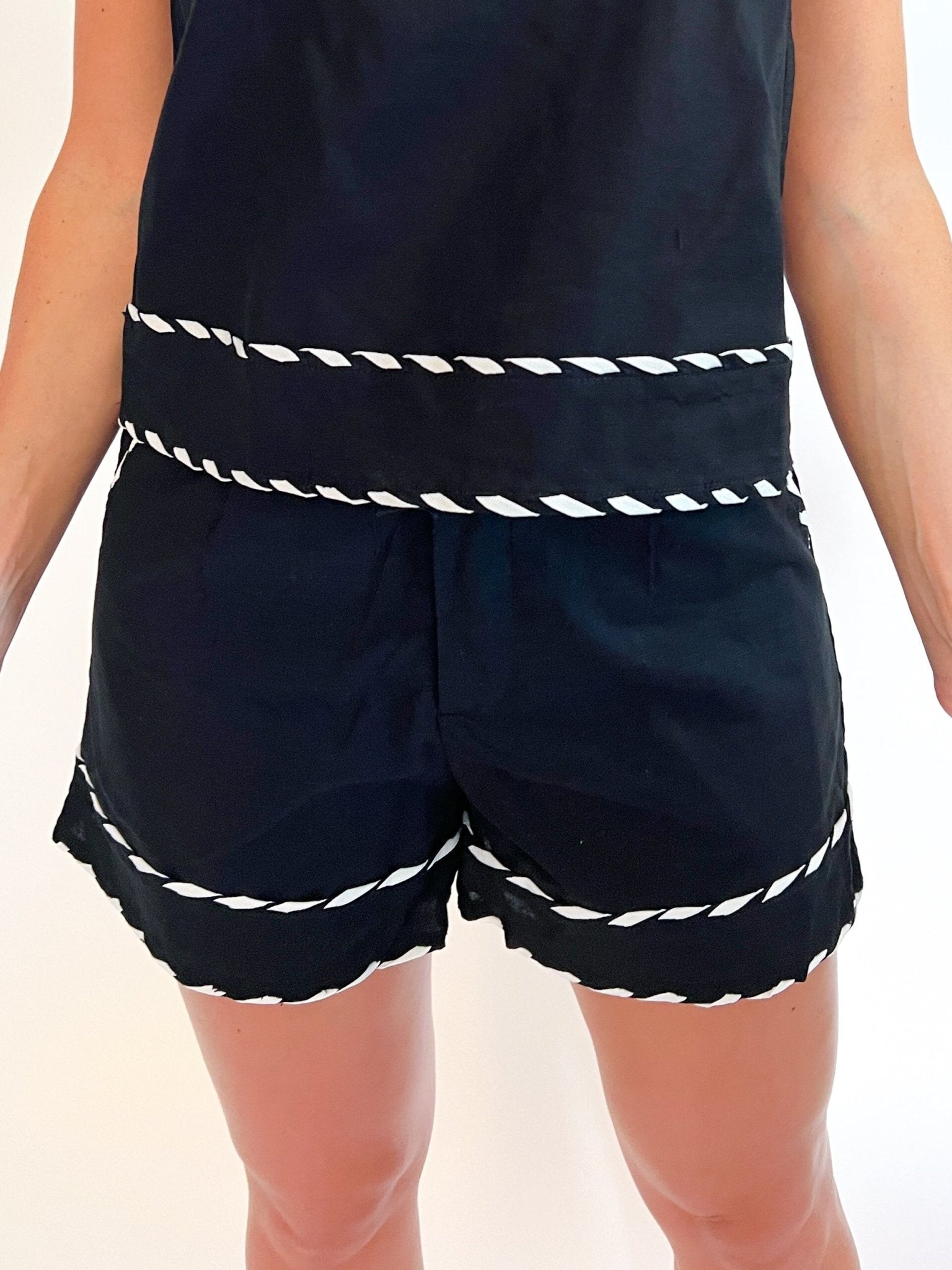 Black tailored shorts with contrast whipstitch trim
