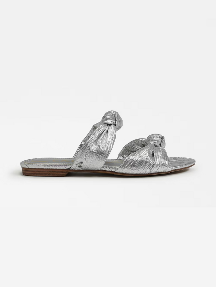 a silver sandals with a knot