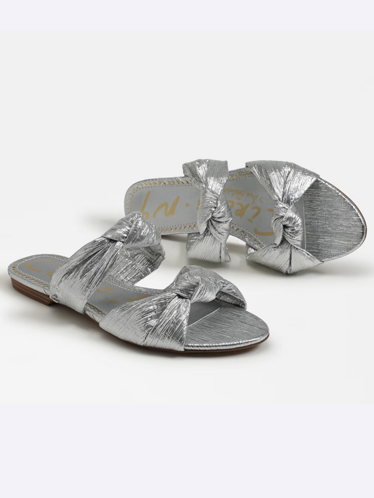 a pair of silver sandals