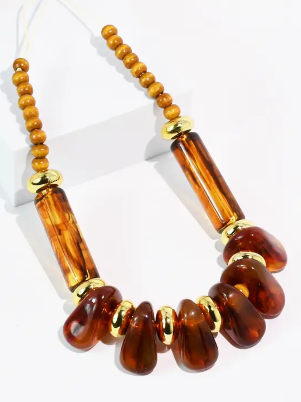 Amber Statement Necklace with oversized amber-toned pendants on white background