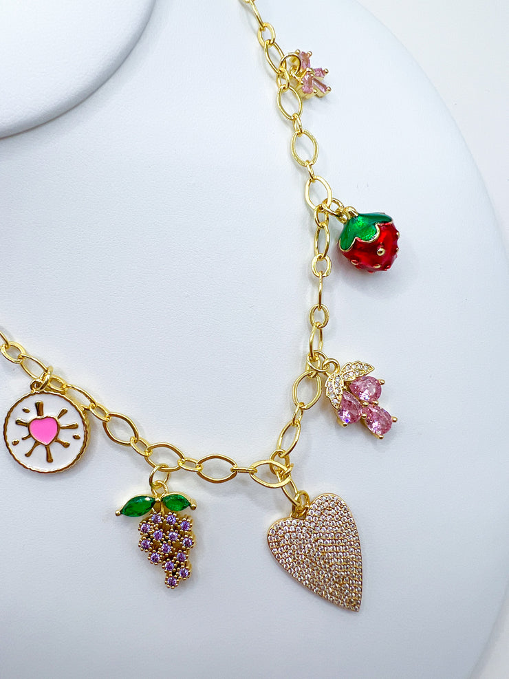 a gold necklace with charms