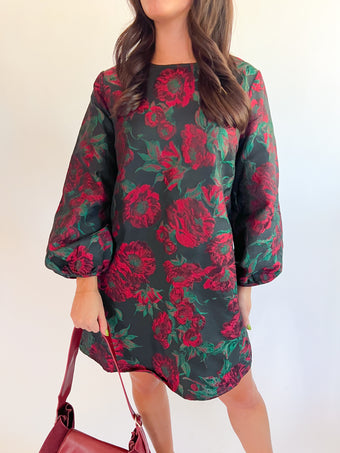 a woman in a floral dress