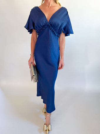 a woman in a blue dress