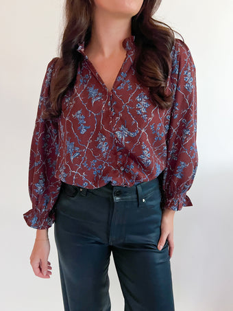 a woman wearing a red blouse