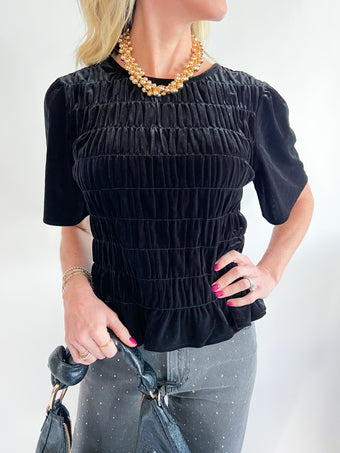 a woman wearing a black shirt