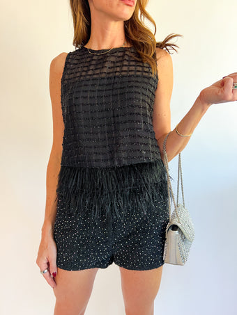 a woman wearing a black dress