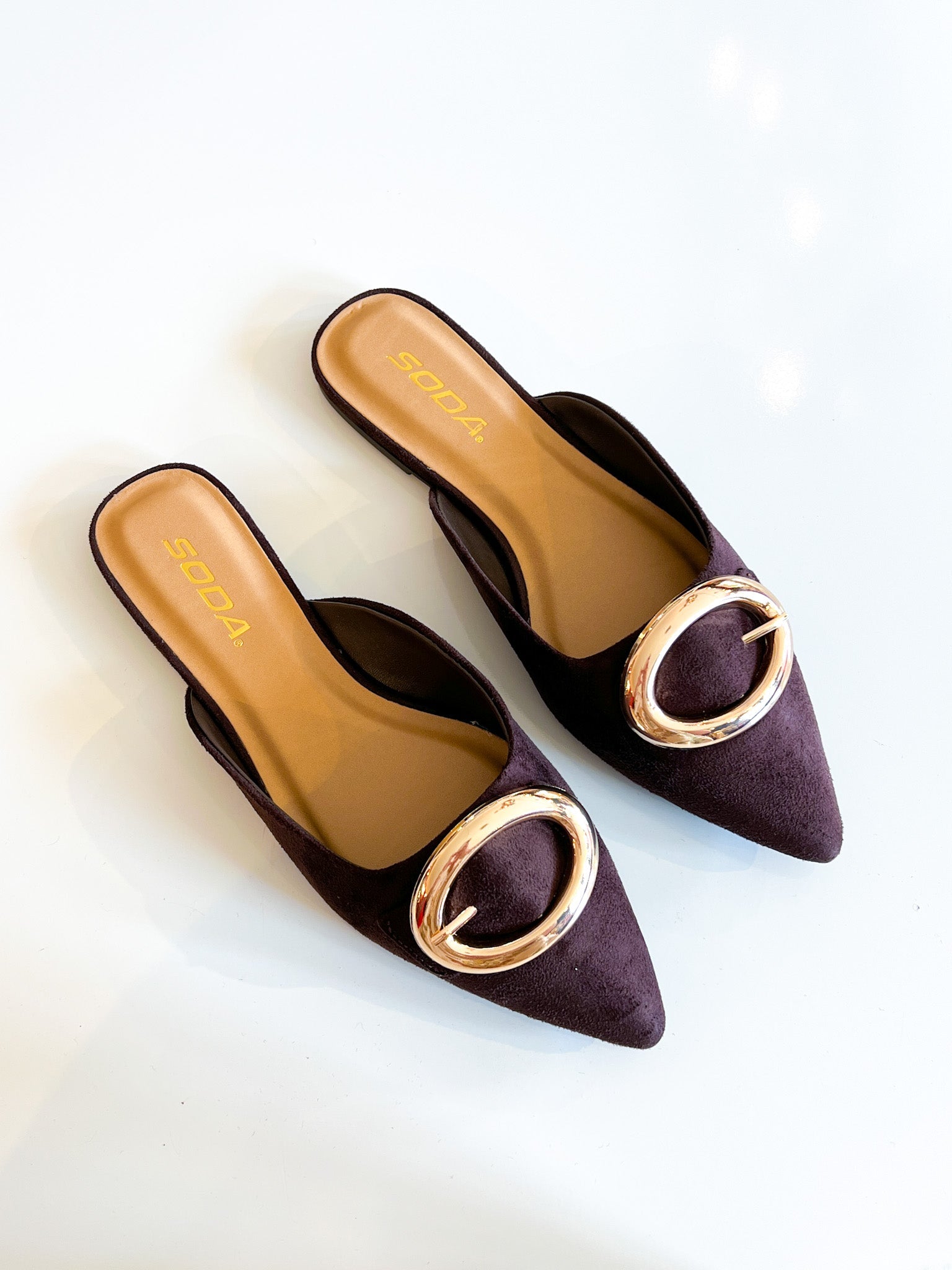 Brown suede mule heels with gold buckle
