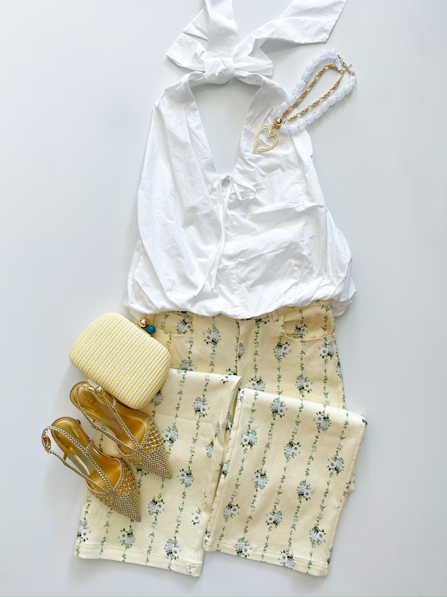 White bubble hem top with deep V-neckline