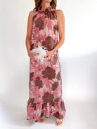 Pink floral maxi gown with high neckline and ruffle hem