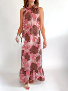 Pink floral maxi gown with high neckline and ruffle hem