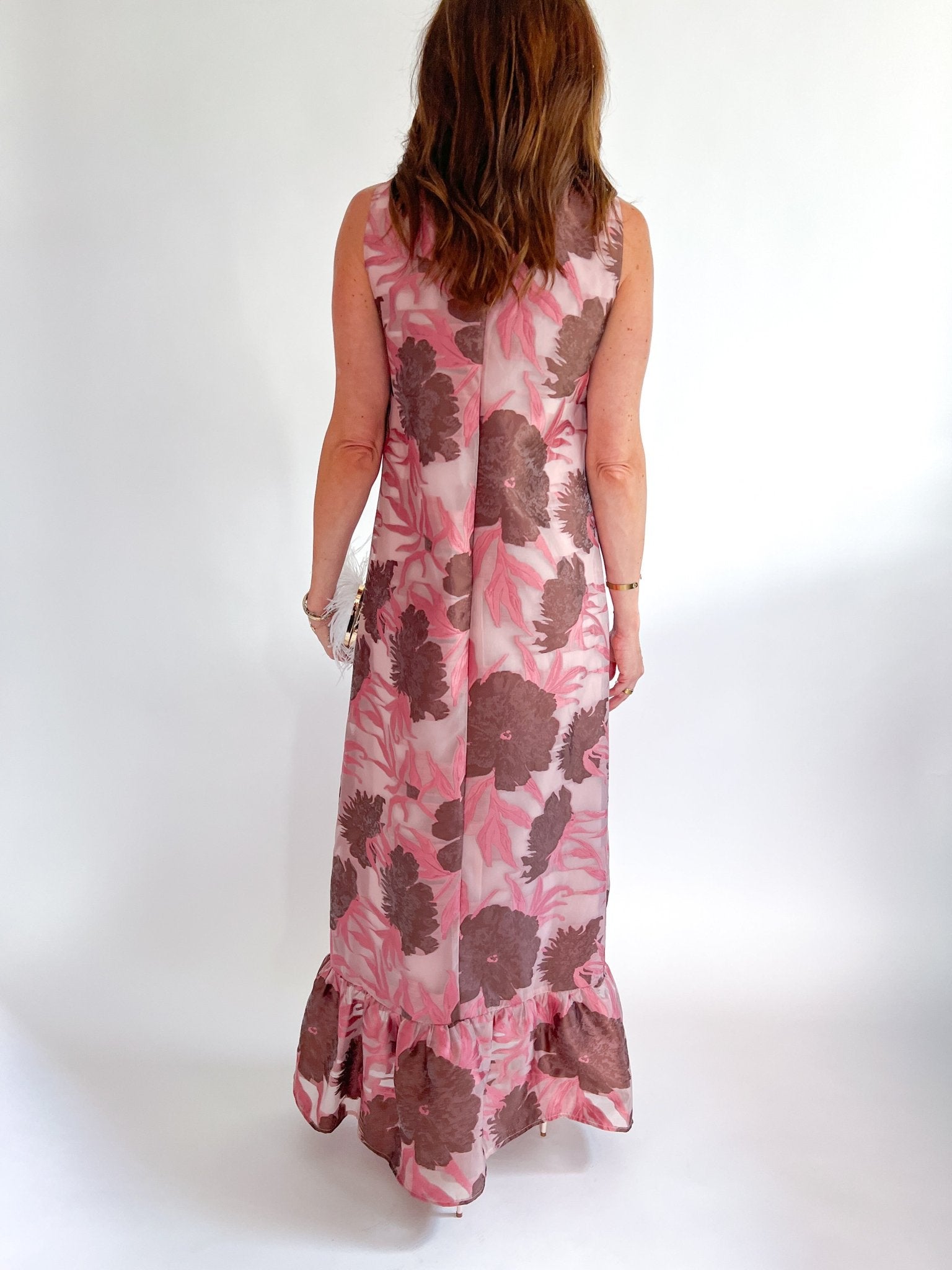 Pink floral maxi gown with high neckline and ruffle hem