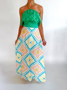 Green eyelet embroidered halter top with scalloped trim