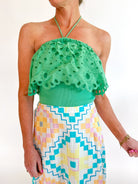 Green eyelet embroidered halter top with scalloped trim