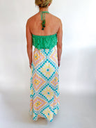 Green eyelet embroidered halter top with scalloped trim