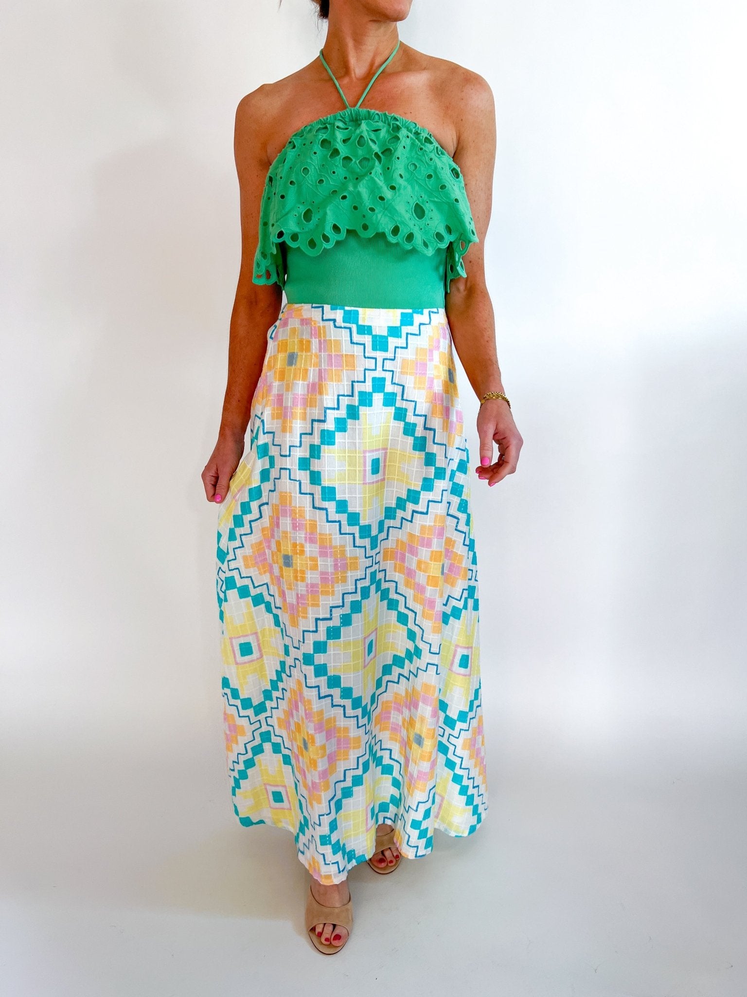 Green eyelet embroidered halter top with scalloped trim