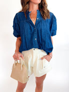 Blue denim blouse with puff sleeves