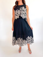Black embroidered midi dress with A-line silhouette