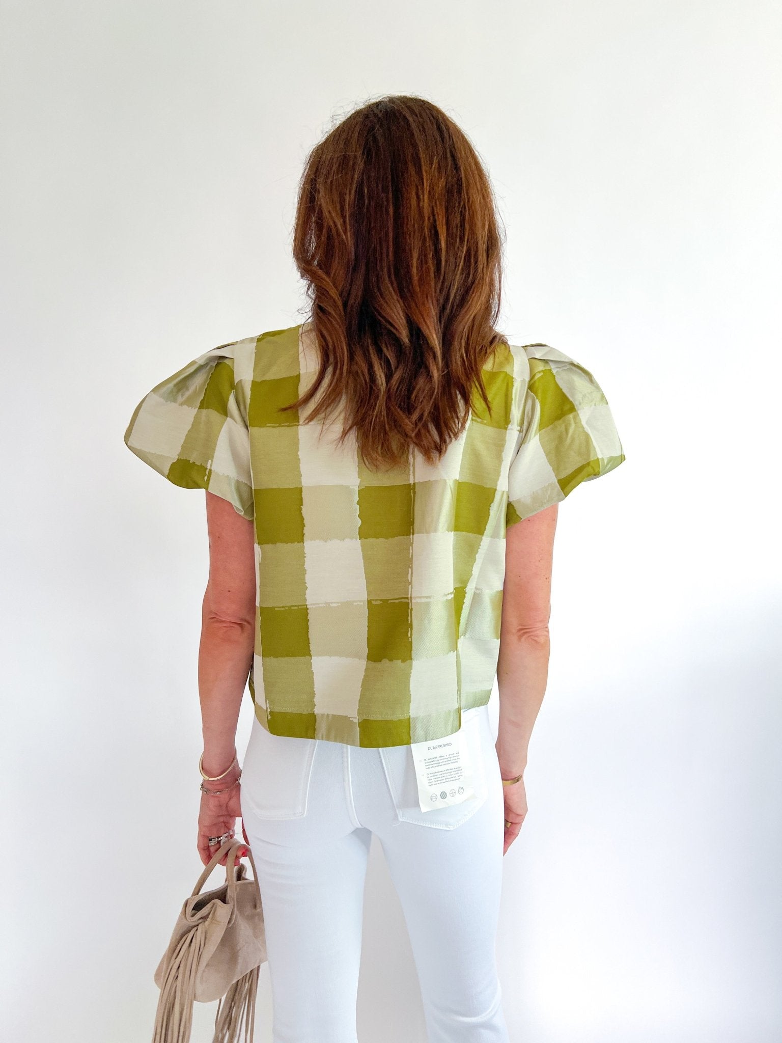 Green gingham top with puff sleeves and open-front bow