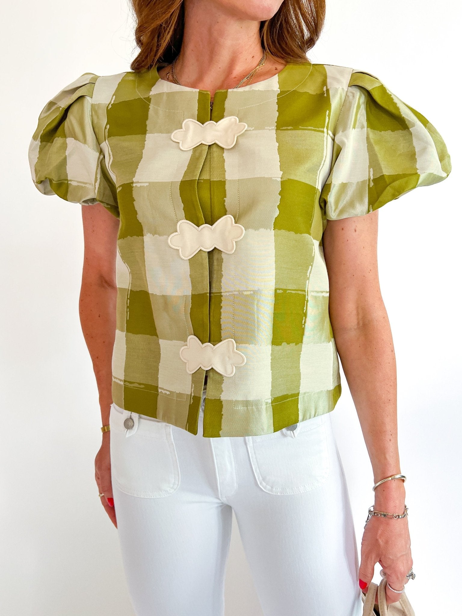Green gingham top with puff sleeves and open-front bow