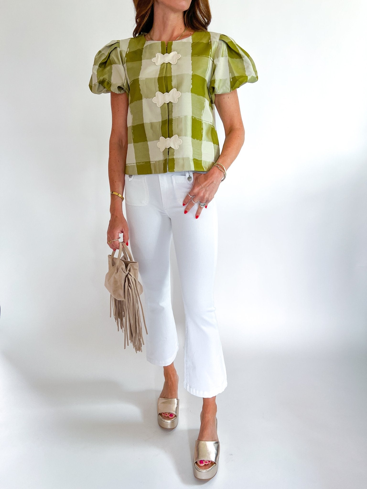 Green gingham top with puff sleeves and open-front bow