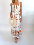Floral embroidered midi dress with flowing silhouette