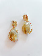 Gold vintage-inspired drop earrings with resin accent