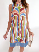Multicolor print sheath mini dress with sleeveless silhouette and fringe hem