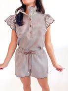 Brown gingham top with scalloped flutter sleeves
