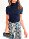 Black ribbed turtleneck top with short sleeves