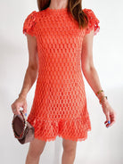 Orange lace mini dress with flutter sleeves