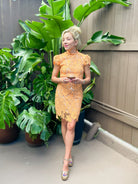 Lace Mock Neck Cap Sleeve Mini Dress in orange with textured lace detail