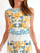 White floral embroidered sleeveless top
