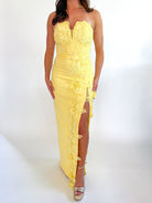 Yellow strapless maxi dress with low V neckline and front slit