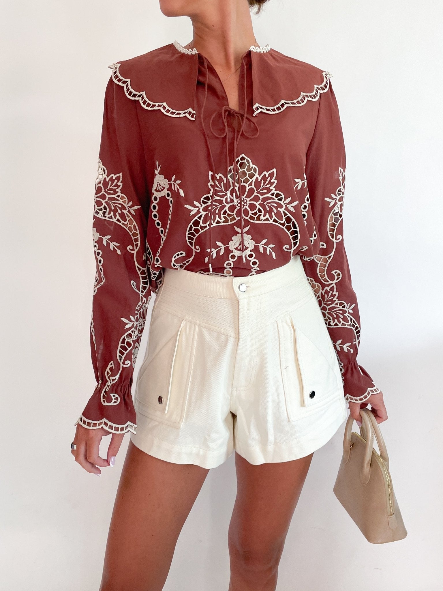 Brown long sleeve top with scalloped eyelet detail