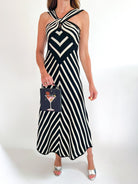 Black and white stripe twist-front sleeveless maxi dress