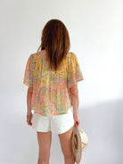 Floral short sleeve top with ruffle details