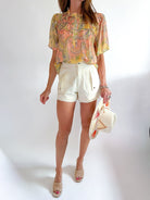 Floral short sleeve top with ruffle details
