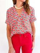 Blue floral top with split neckline