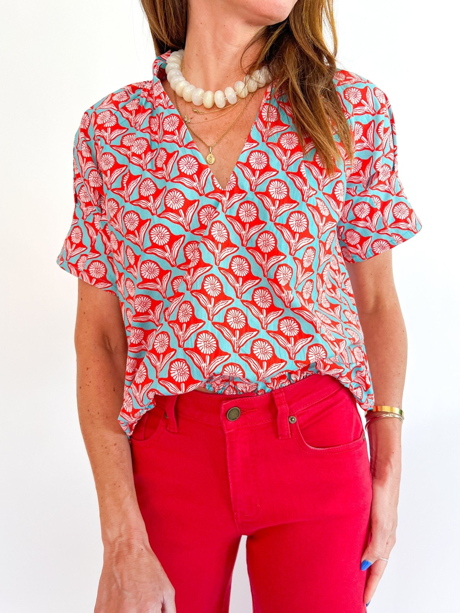 Blue floral top with split neckline