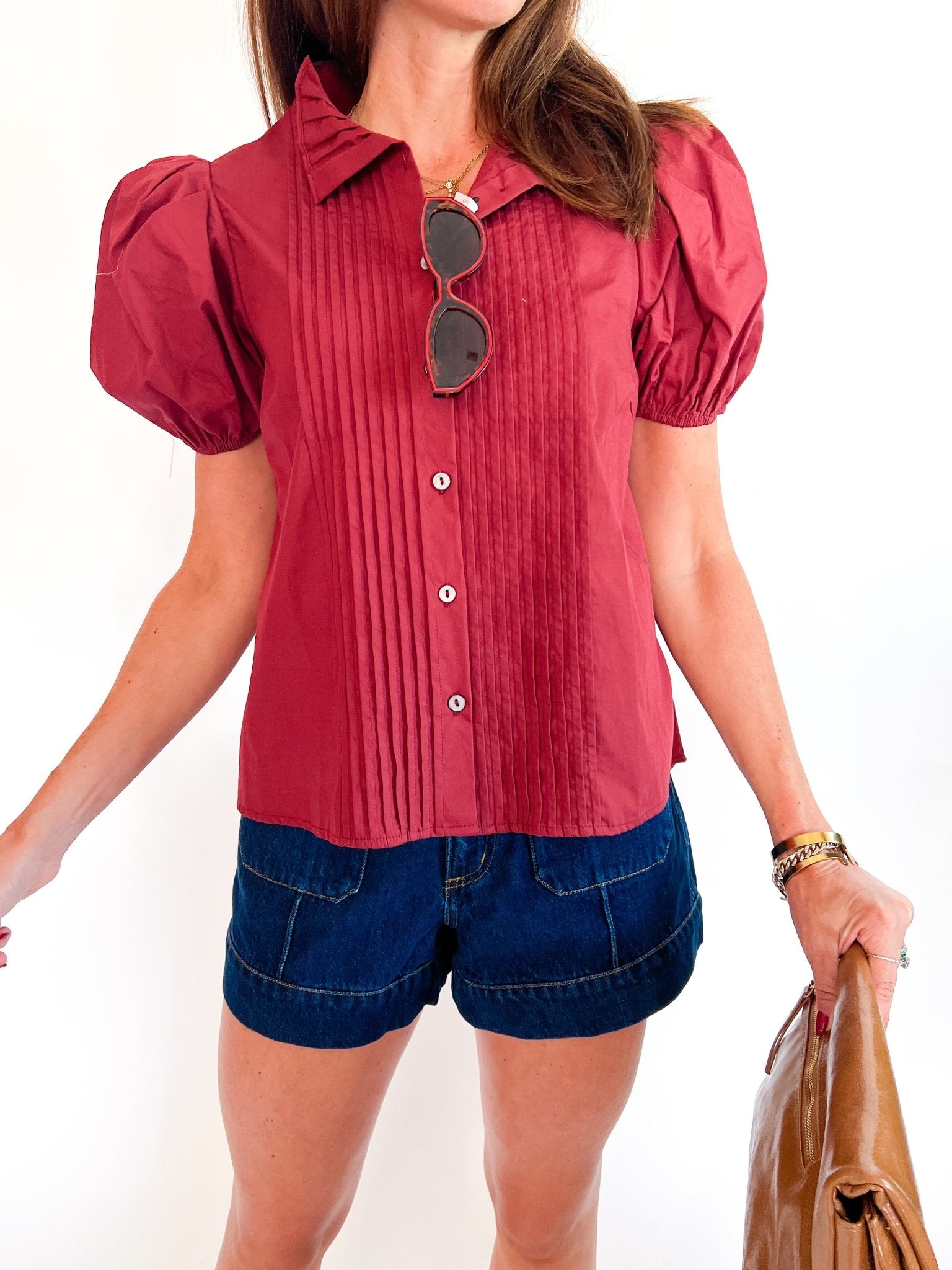 Red pintuck top with short puff sleeves and button front