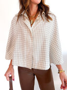Brown plaid poncho-style button down top