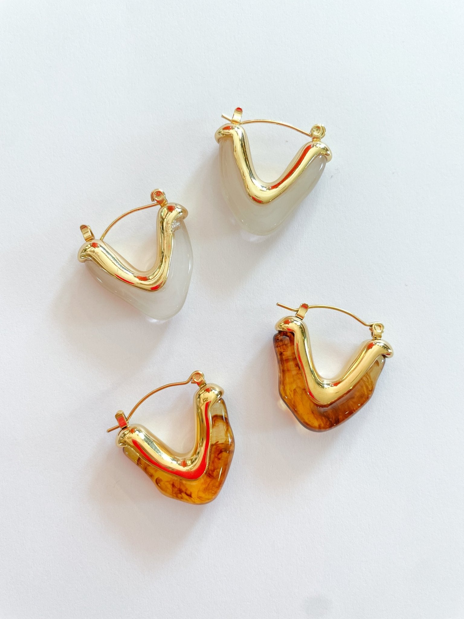 Gold triangle hoop earrings with resin accent