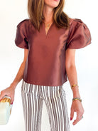 Brown satin blouse with short puff sleeves