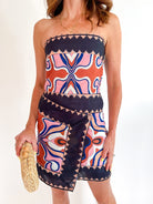Black multi scalloped print strapless wrap mini dress
