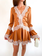 Brown long sleeve mini dress with ruffle trim