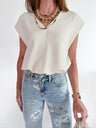 Off-white cap sleeve top with structured silhouette